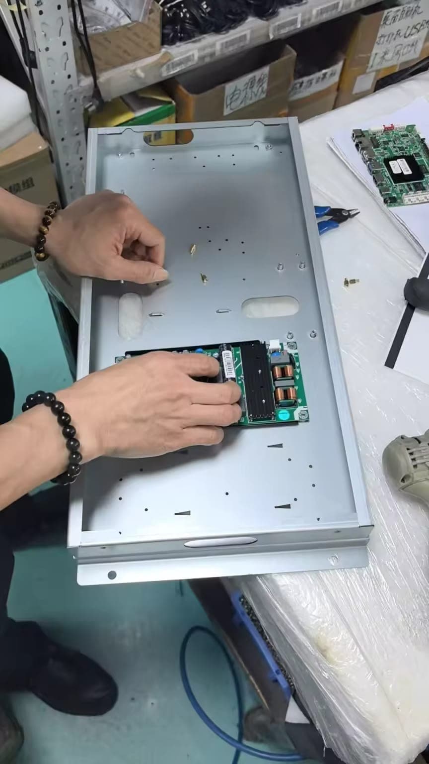 MOVO-X Kiosk — Assembly process in factory